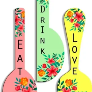 Three decorative wall hangings shaped like spoons, each featuring an African-inspired design. The dimensions of the wall hangings are 20 inches (51 cm) in length and 15 inches (38 cm) in width.