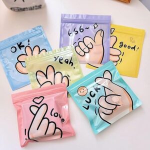 Poojavi 36 Pcs Korean Style Ziplock Pouches for Gifting, Birthday Return Gift Packing, Candy, Snacks, Dry fruits, Cookies, Small Items | PVC Bags with Hand Sign Prints ? Multicolor (Random)